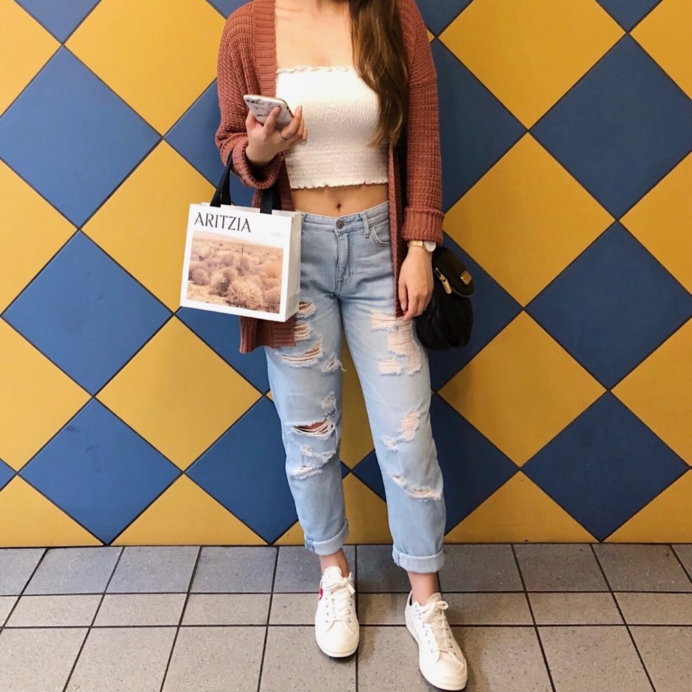 Distressed light blue denim jeans
